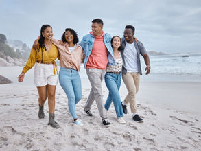 Happy group of youngsters on the beach