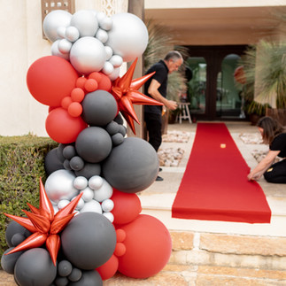 Red caroet and luxury balloon garland entrance