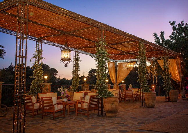 pergola with fairy lights at sunset.jpg