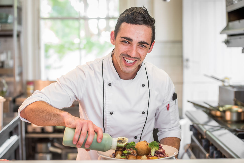 Private chef Saint-Tropez plating a gourmet dish in a bright villa kitchen — profile image for ME•N•U.”