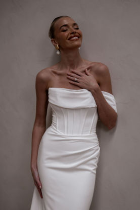 The Rhode wedding dress by Made With Love Bridal. fitted wedding dress, crepe wedding dress, off the shoulder wedding dress, simple wedding dress. wedding dress shop farnham, wedding dress shops in Surrey, corseted wedding dress, wedding dress shop near london, wedding dress shop near Guildford. plain wedding dress.