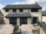 house rendered in white render