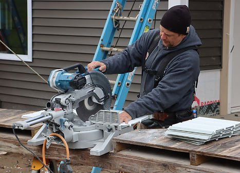 GLS Contractor cutting siding