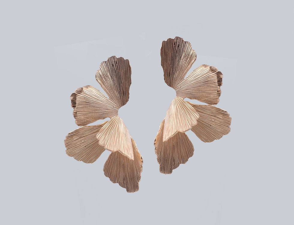 Elegant orchid-shaped earrings inspired by blooming flowers — floral statement jewelry with delicate petal details, perfect for nature-inspired or botanical fashion trends