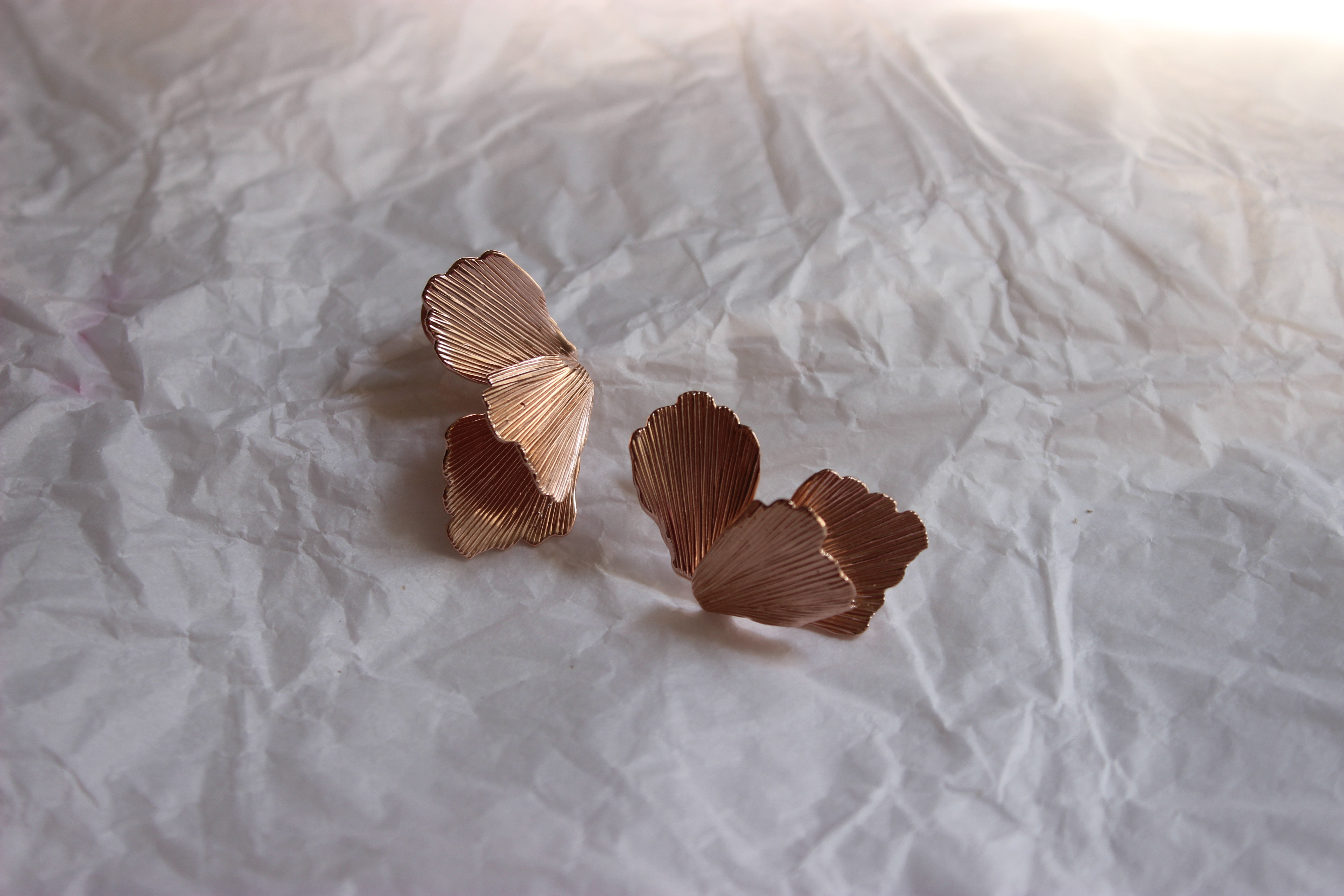 Elegant orchid-shaped earrings inspired by blooming flowers — floral statement jewelry with delicate petal details, perfect for nature-inspired or botanical fashion trends