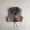 Miniatyrbild: fron of bolero-vest in light brown sheepskinleather inside and collar in grey curly fleece