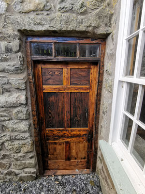 Original timber door prior to restoration