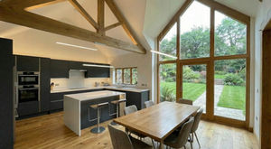 Modern kitchen in a traditional barn style new build