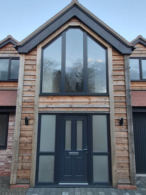 A double height, vaulted entrance with gable glazing to maximise internal light.