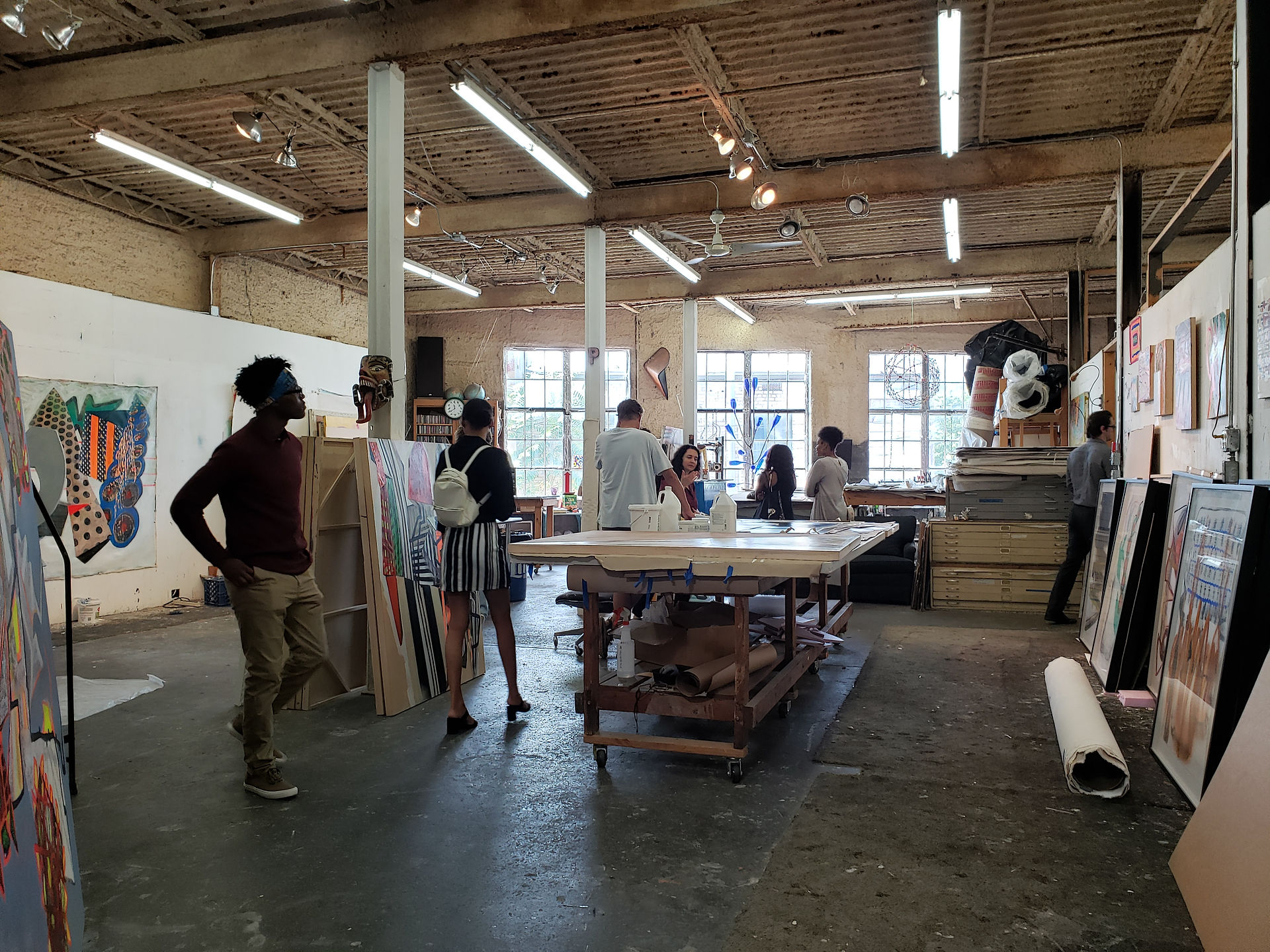 The Arts Interns inside Pinkney Herbert's studio at Marshall Arts. Herbert is one of Marshall Arts' founders.