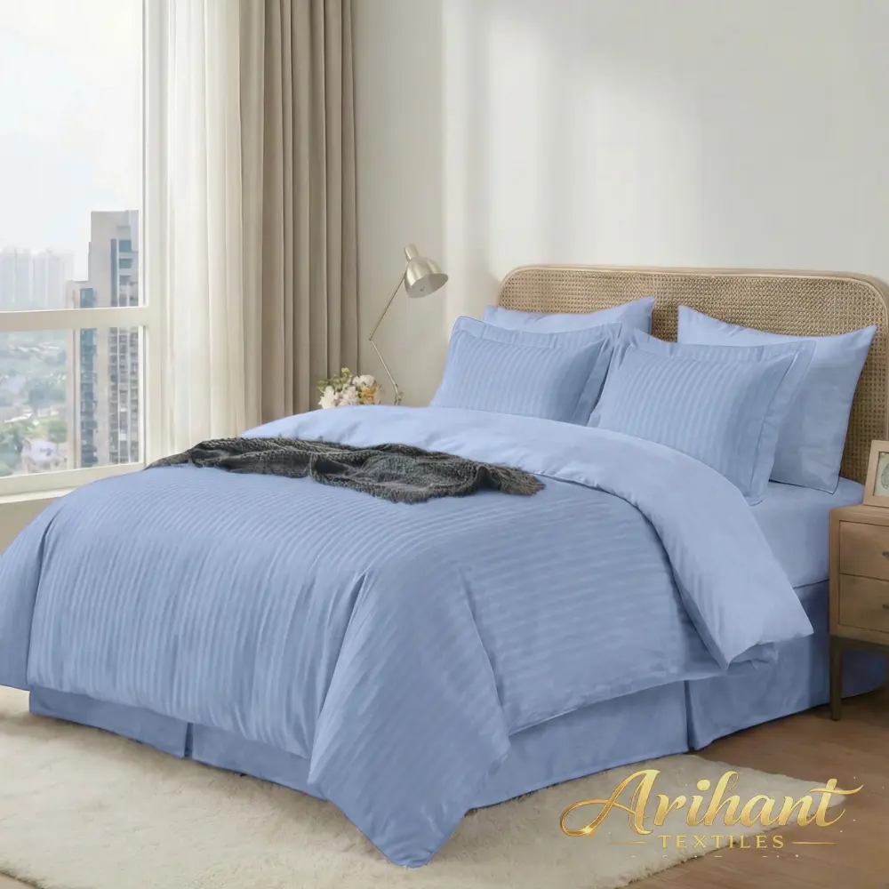 Blue stripes hotel bedsheet manufactured by Arihant Textiles, a leading hotel linen manufacturer in Panipat for bulk global supply.