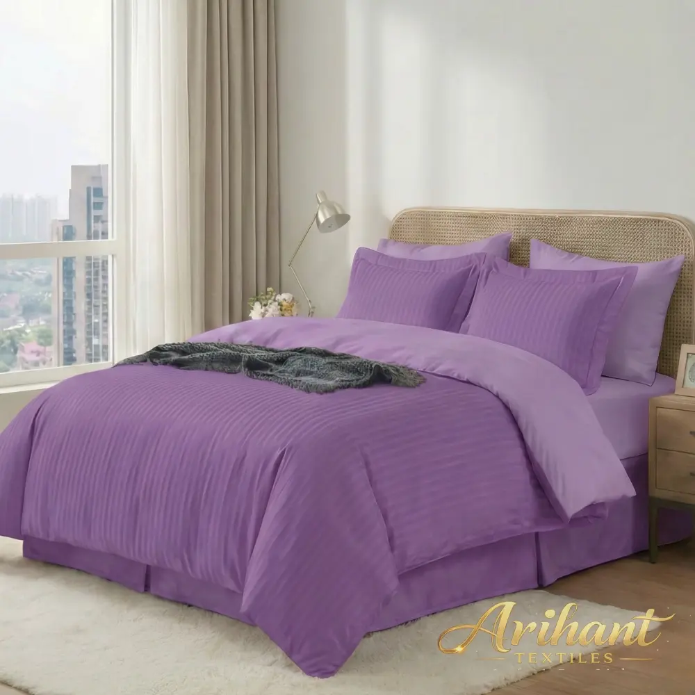 Purple stripes hotel bedsheet manufactured by Arihant Textiles, a leading hotel linen manufacturer in Panipat for bulk global supply.
