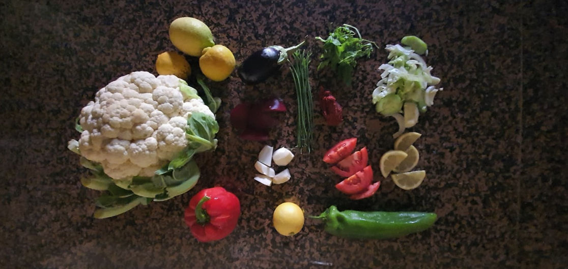 A colorful array of home-grown vegetables and fruits from our kitchen garden at Dar Gonzo, symbolising our dedication to natural, sustainable living and farm-to-table dining.