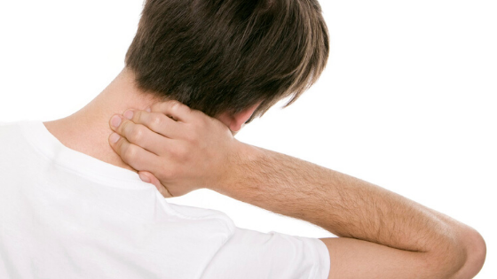Man holding neck in pain