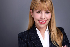 A corporate headshot of a business woman with long blonde hair and wearing a white shirt with a dark pinstriped suit coat.  Clicking this image will take you to the corporate headshot page of this website.