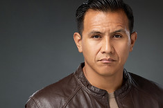 A headshot of a Los Angeles actor dressed as a gritty detective in a brown leather jacket. Clicking this image will take you to the acting headshot page of this website.