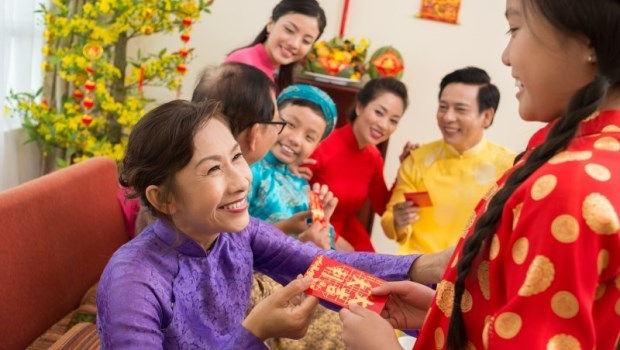 A grandma is giving her grandchild lucky money.