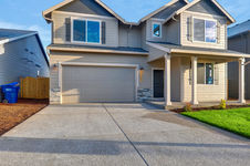 Spacious family home with expansive windows, designed to embrace the beauty of the surrounding woods.