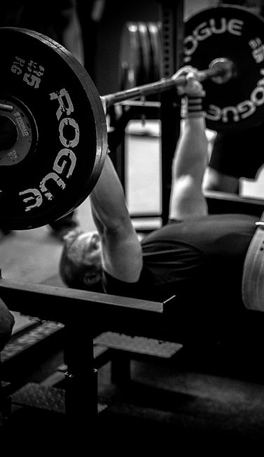 bench pressing in black and white