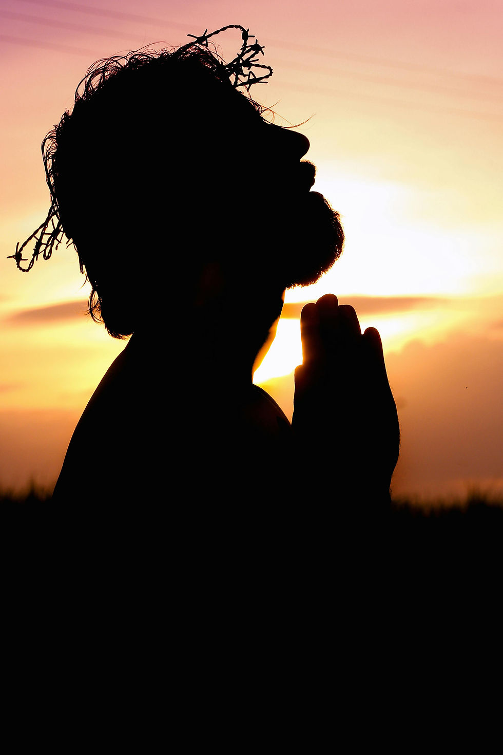 Man praying with a silhouette reminiscent of Jesus