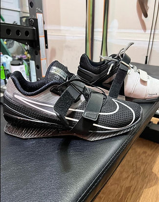 Lifting shoes with raised heel