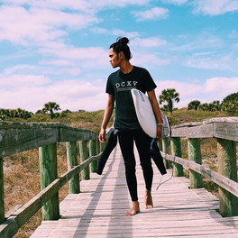 DCXV fan photo wearing logo shirt and surfing