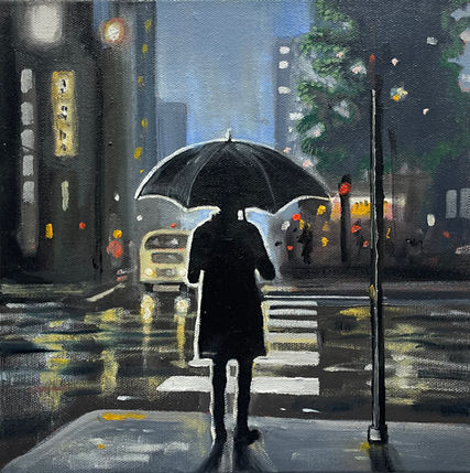 Man at crosswalk in dusk rain in cityscape