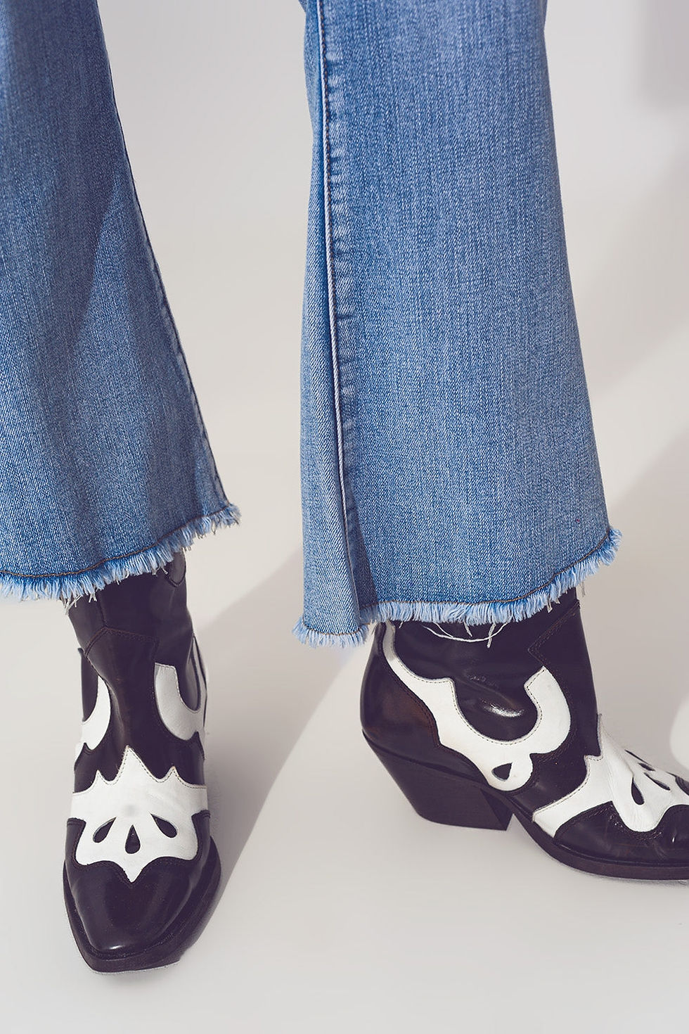 Thumbnail: Flared Jeans in Light Blue With Asymmetric Hem