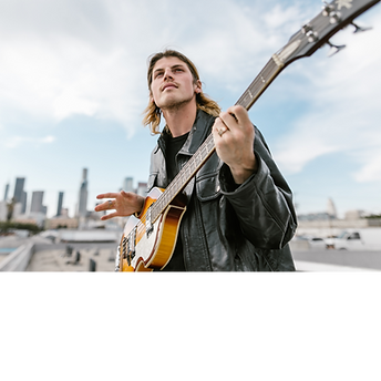 Guy playing guitar at a concert