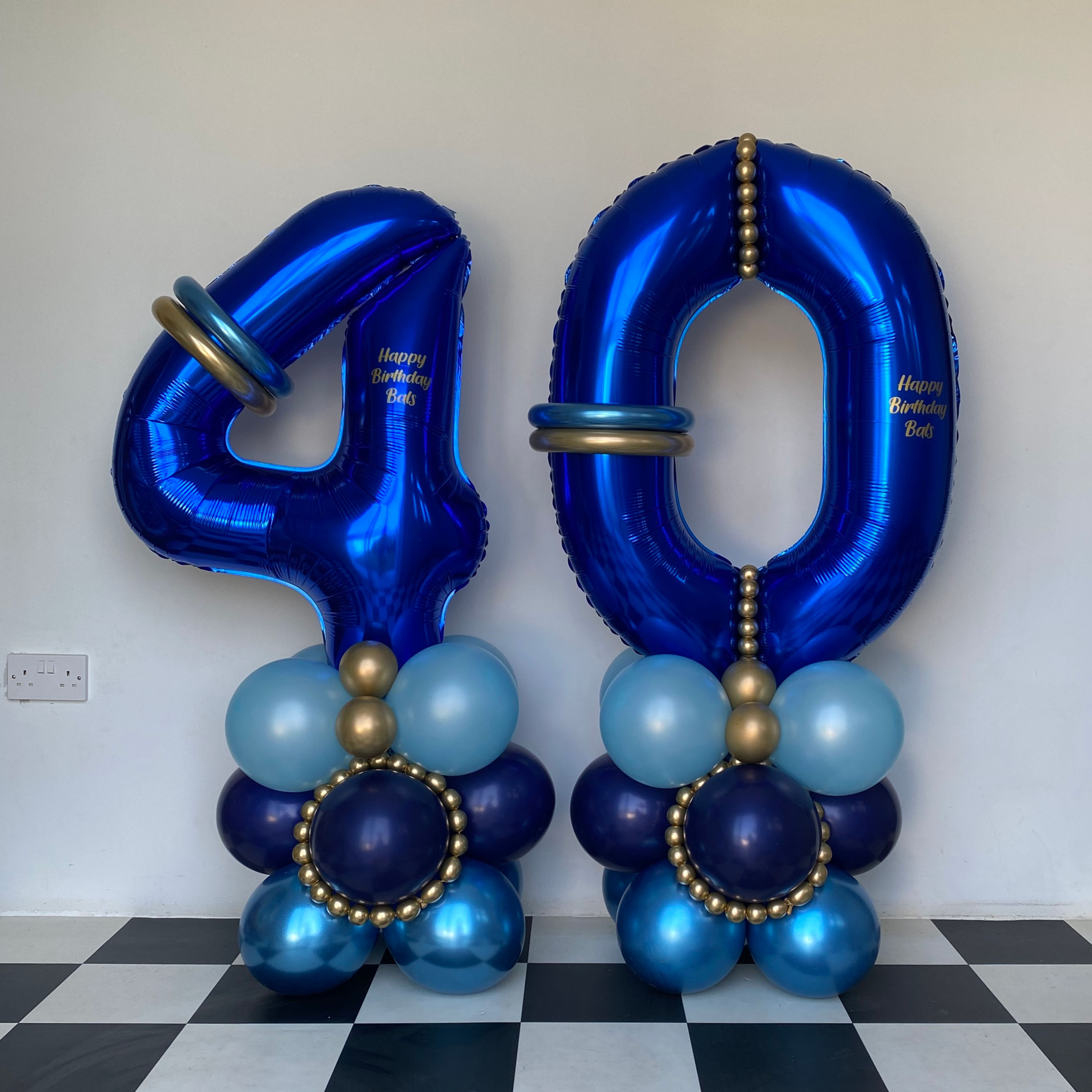 Blue number 40 balloon decorations. Happy Birthday Mom text on balloons. Party World Ferndown.