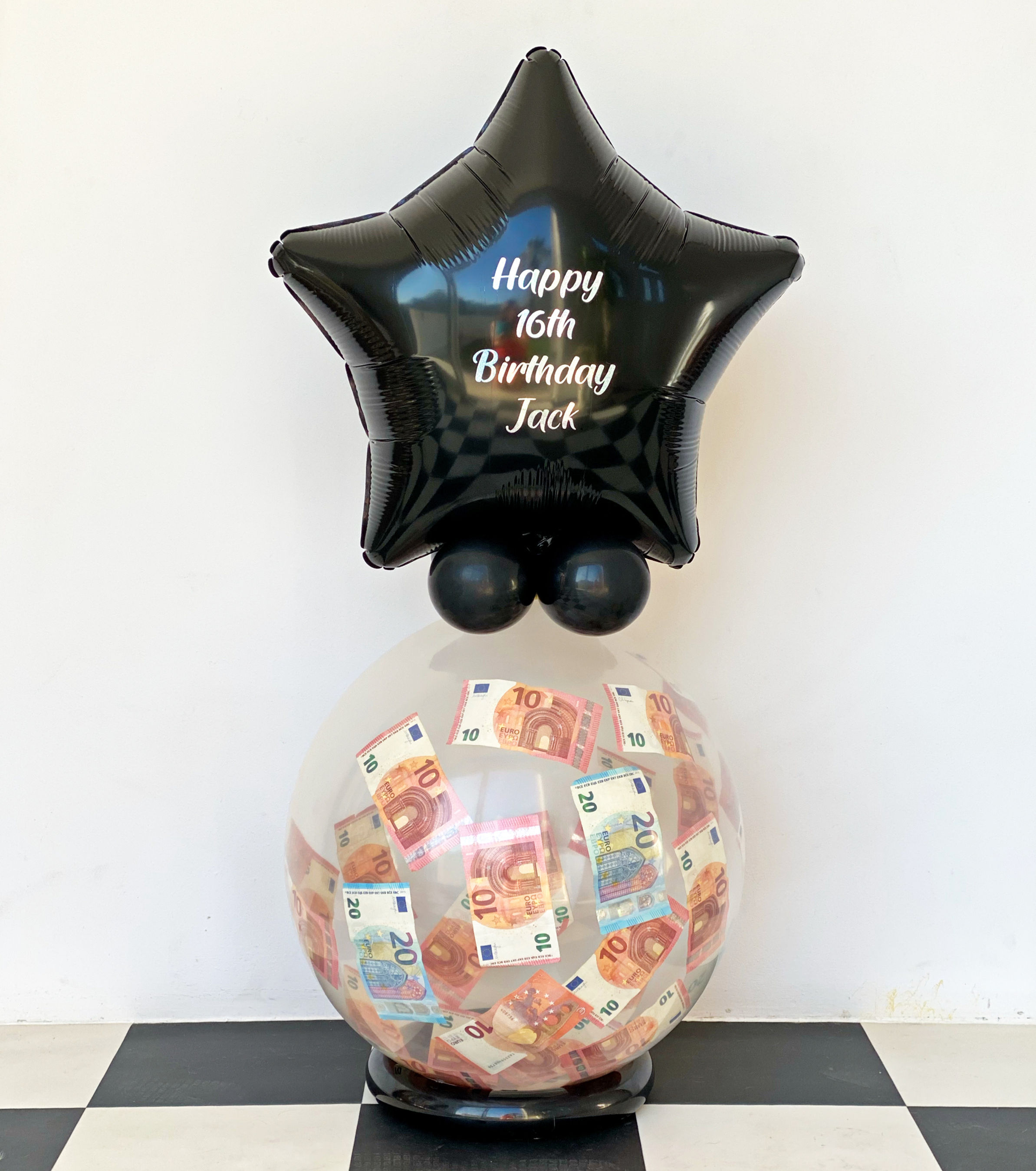 Black star balloon with Happy 16th Birthday Jack money gift balloon.