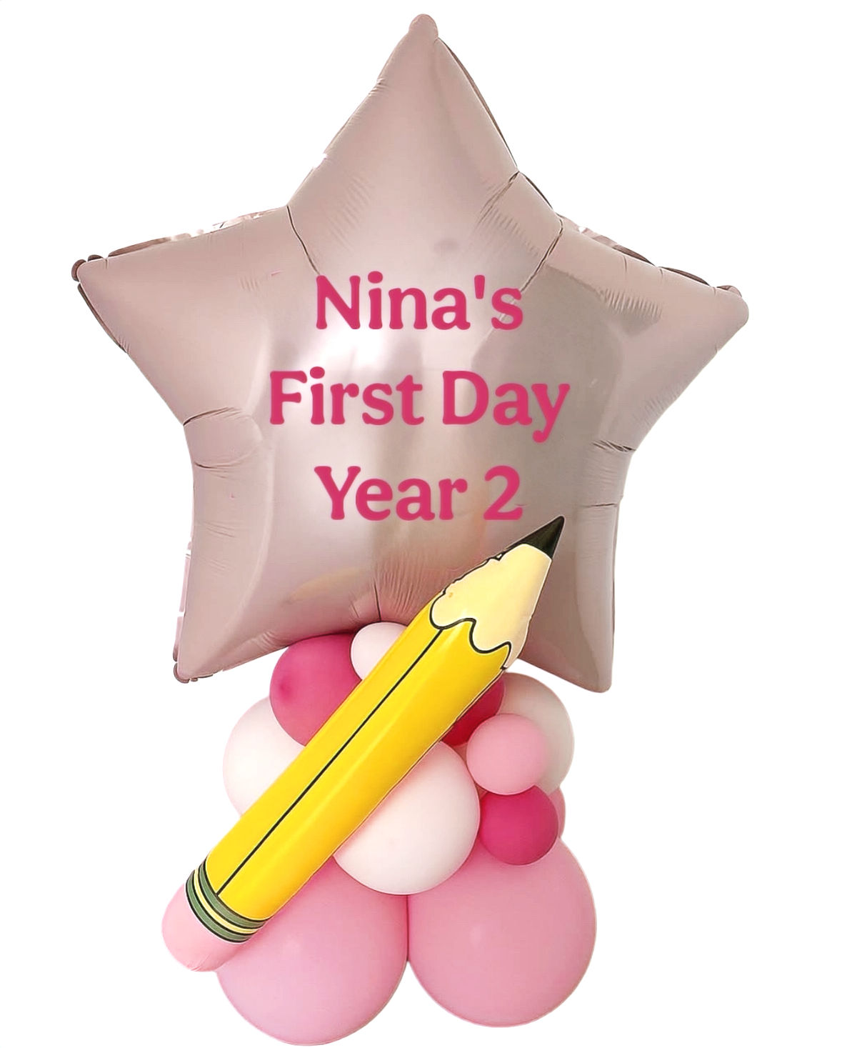 Star-shaped balloon Nina's First Day Year 2 with a pencil and pink balloons.