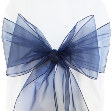 Navy blue organza chair bow, elegant decoration for event setting, close up.