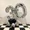 Thumbnail: Silver number thirty balloon display featuring black and silver balloons on checkered floor