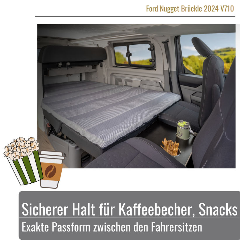 Fahrezuginnenansicht des Ford Nuggets das Brückle ist zwischen den Sitzen geklemmmt und mit Snacks bestückt