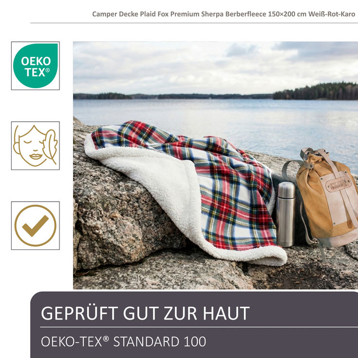 Black Forest Fox Campingdecke Karo mit Teddyseite auf einem Fels drapiert am See, mitdabei Rucksack Oos, Thermosflasche