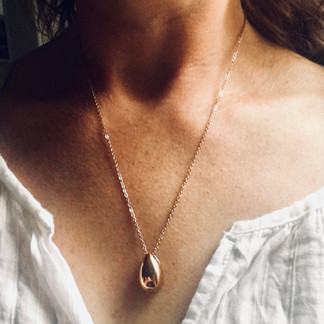 rose gold memorial urn necklace on model
