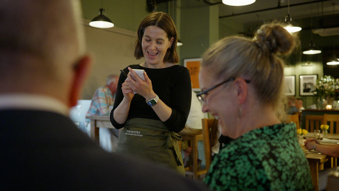A waitress taking an order at the Pantry Restaurant Newmarket