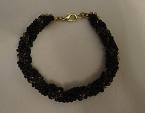 110 Bracelet - black spiral w amber core