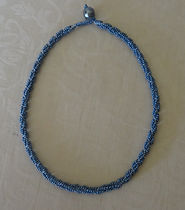 132 Necklace - denim seeds in spiral, gl