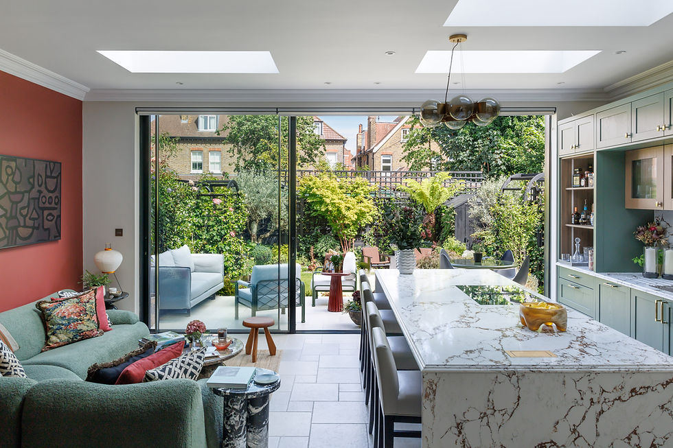 Warm open-plan kitchen and living room in a West London Edwardian home designed by Studio Jordao