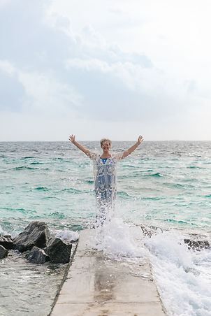 Anne coverup pier hands up splash_edited.jpg