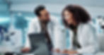 Scientist, teamwork and happy with laptop in laboratory for test breakthrough, pharmaceuti