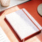 Closed A5 notebook on desk