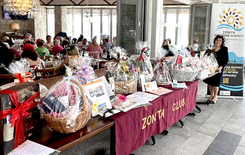 2023 Melbourne Cup fundraising table of baskets & organiser.jpg