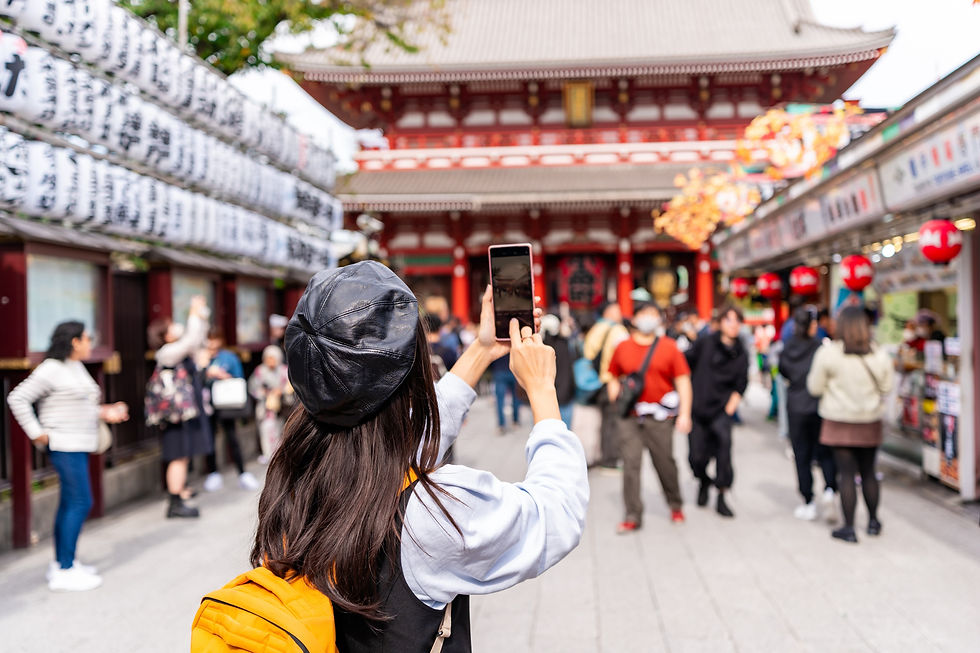 young-female-tourist-taking-a-photo-of-sensoji-tem-2026-03-26-23-17-22-utc.jpeg