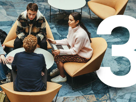 4 students having a conversation on campus with a designed #3 for the 3 ways Trauma Coverage can help after Witnessing Violence