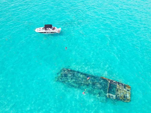 Aerial view of a Turks and Caicos shipwreck and boat