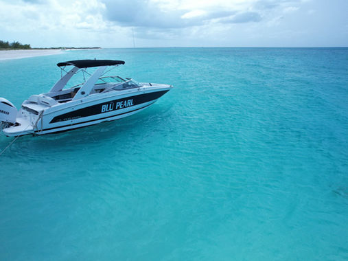 Private charter boat near a beach in Turks and Caicos