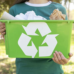 close-up-woman-holding-recycling-basket-in-nature-min-1539x1024.jpg
